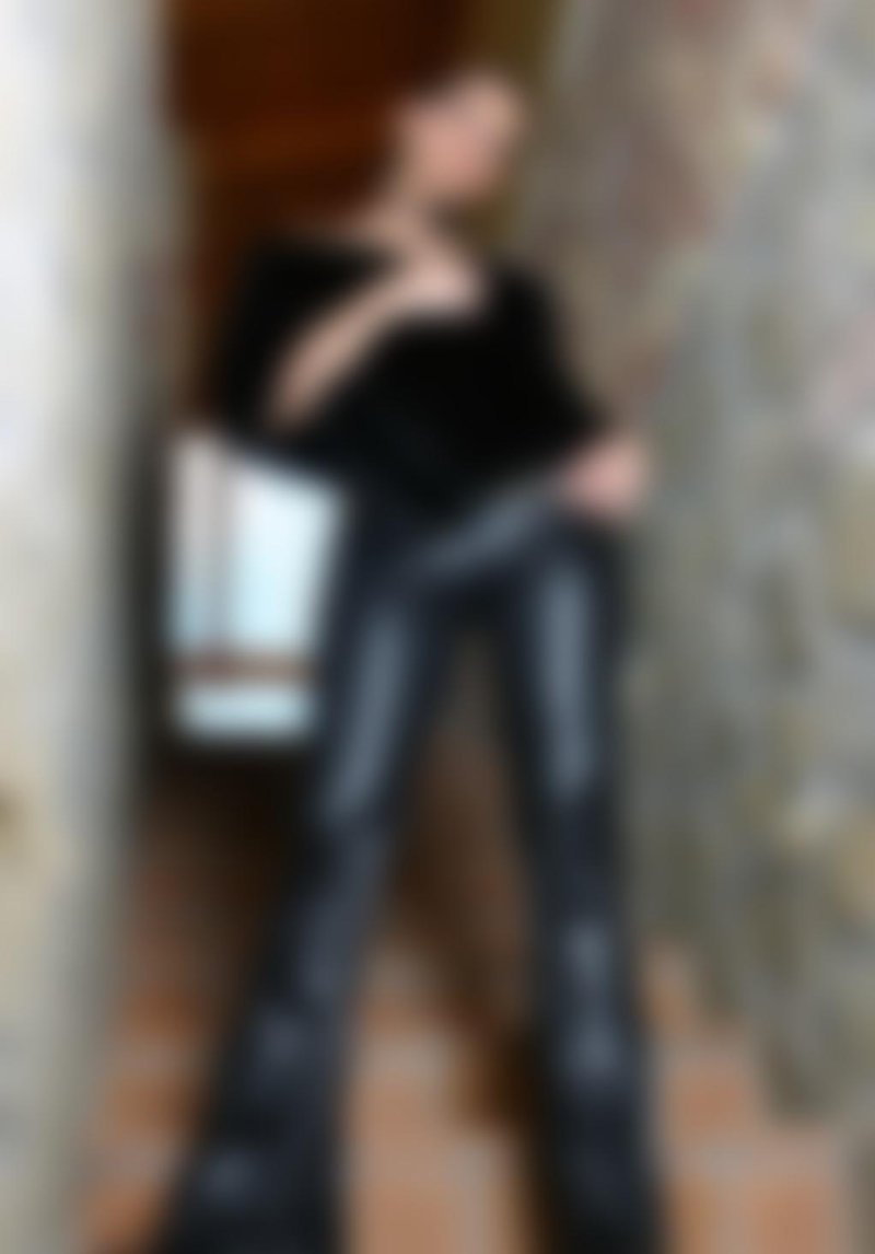 Flared up artificial leather trousers