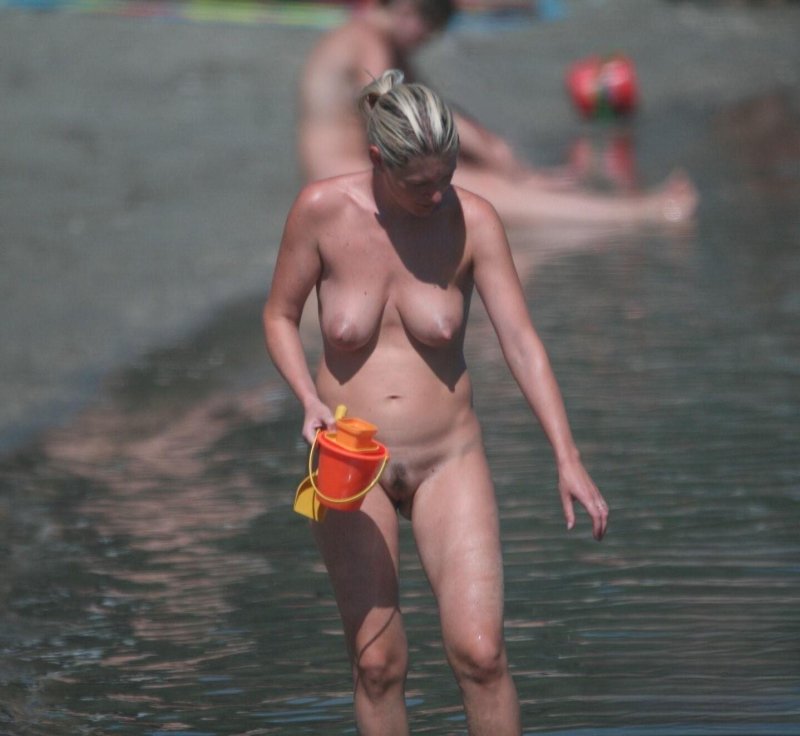 Naked mothers on the beach