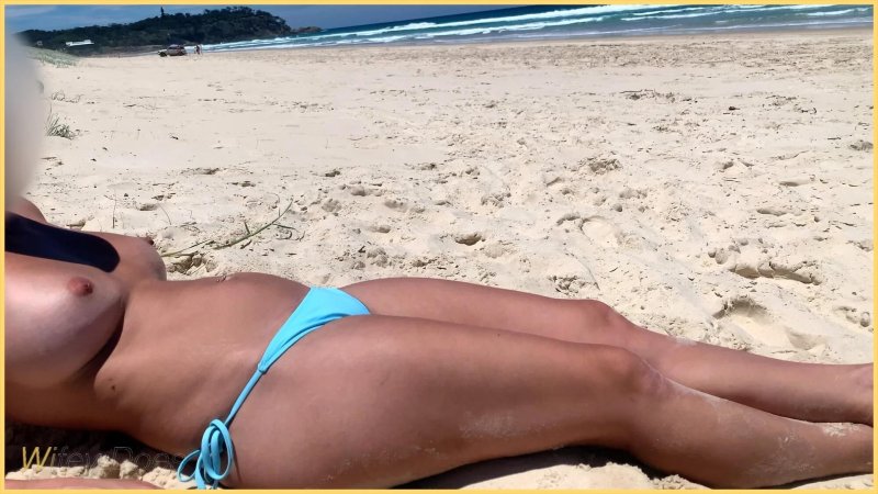 On the beach topless