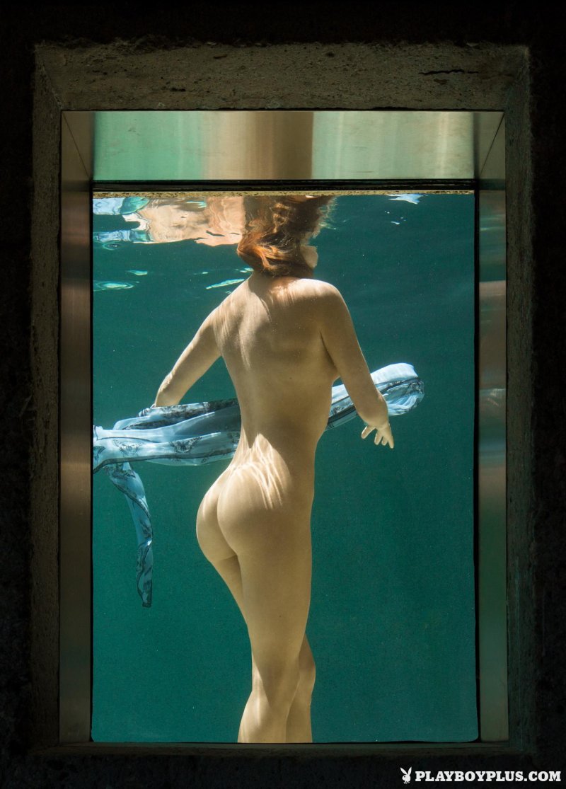 Woman behind glass naked