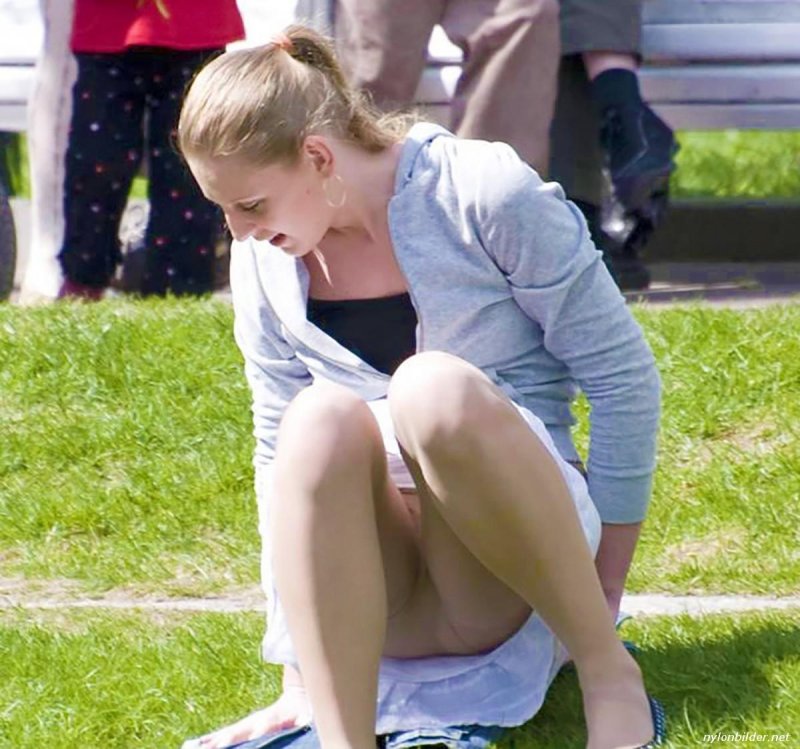 Under a skirt of sitting girls