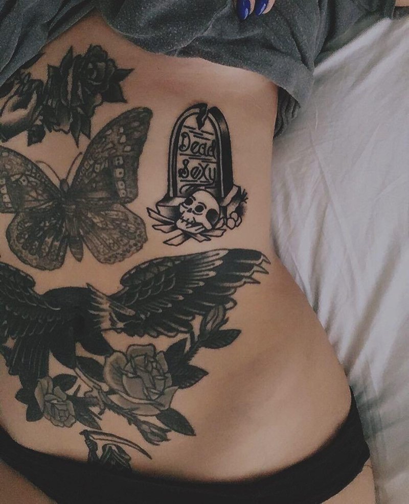 Feminine tattoo on the stomach