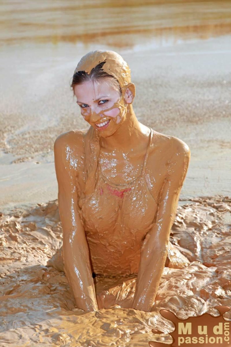 Girl in mud without clothes