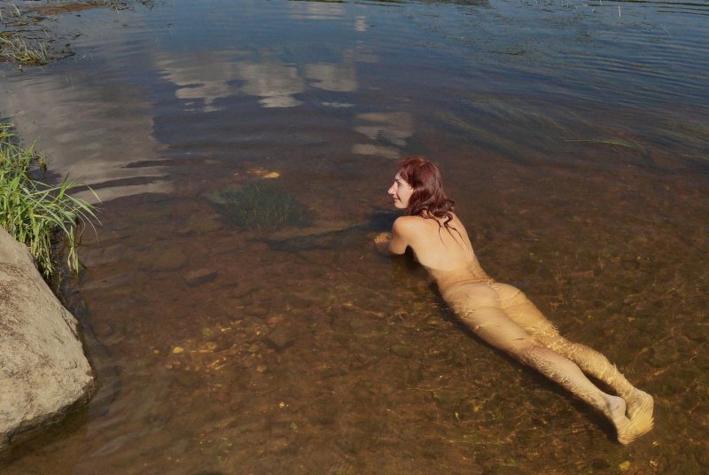 Naked girls swim in the river