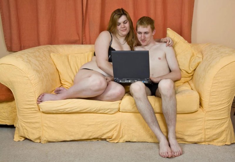 Boy and girl on the couch with a tablet