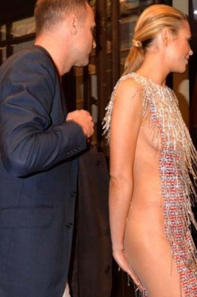 In a transparent dress public