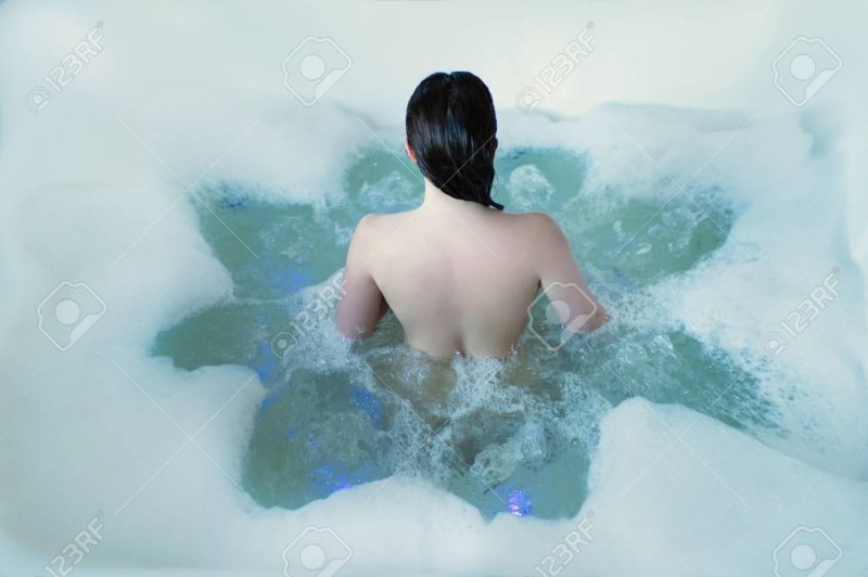 Naked girl in a jacuzzi