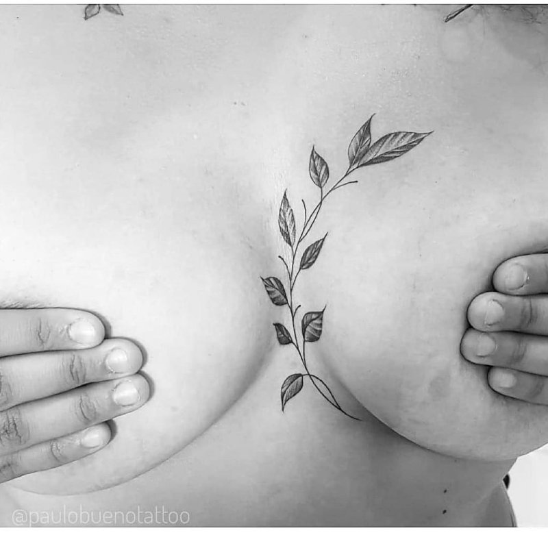 Tattoo twigs under the chest