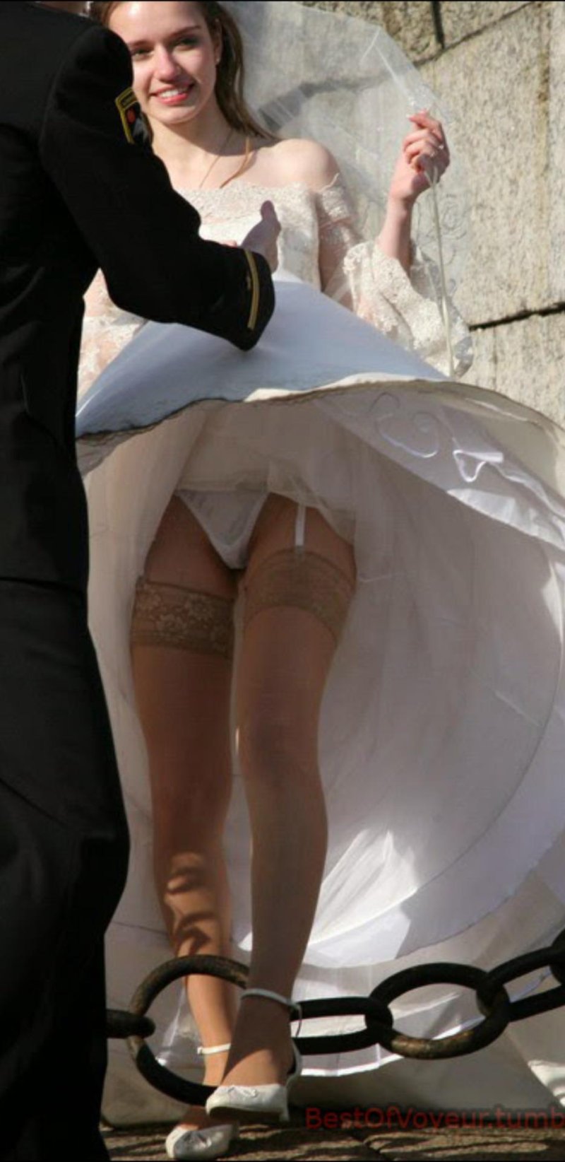Looking under the dress of bride