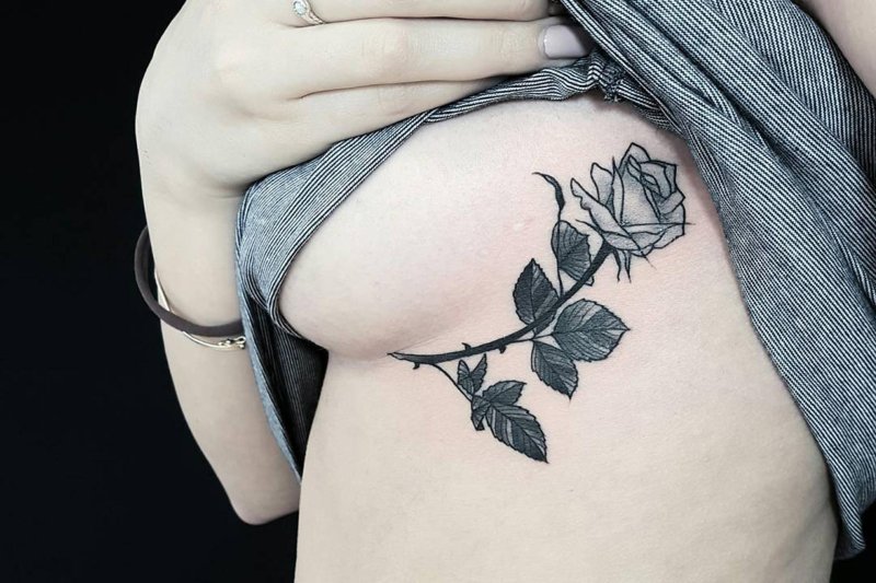 Under the chest tattoo