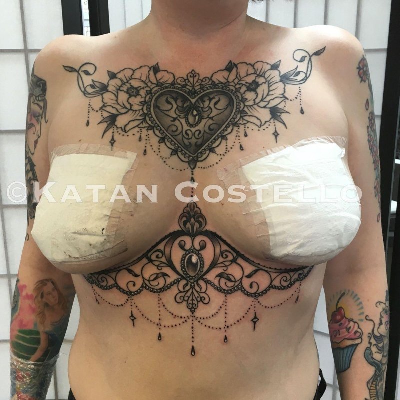 Female tattoo under the chest