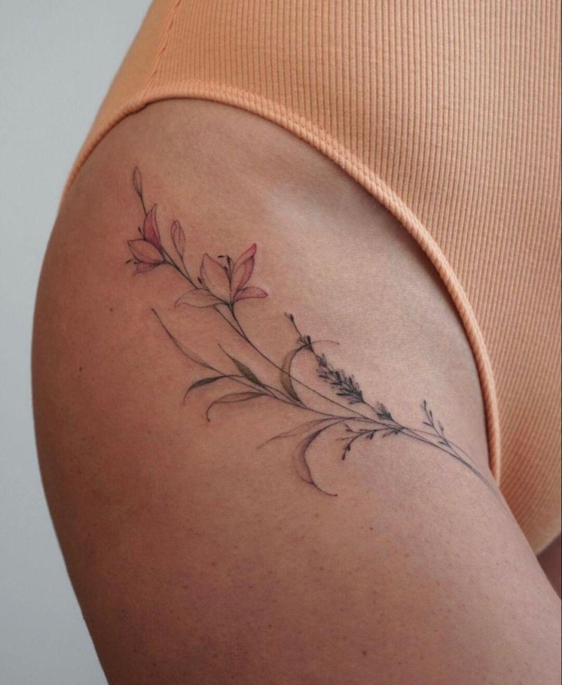Female tattoo on the thigh