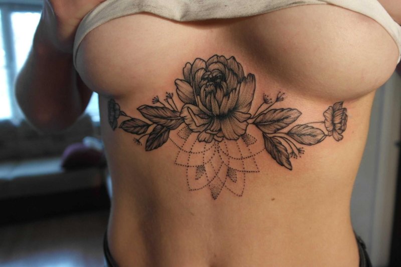 Female tattoos under the chest