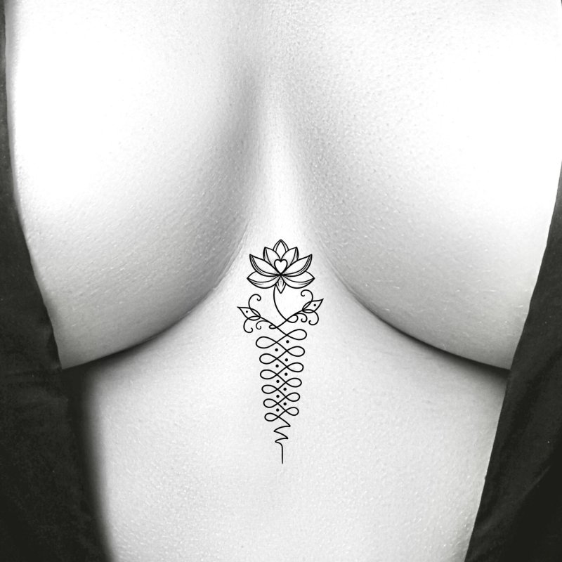 Unalome tattoo between the sternum