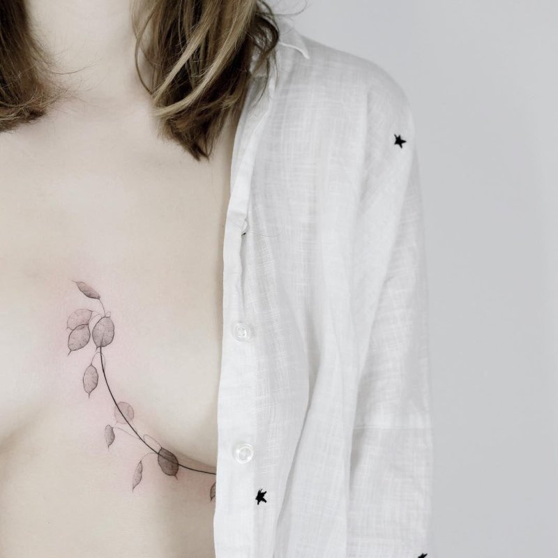 Tattoo under the chest of girl