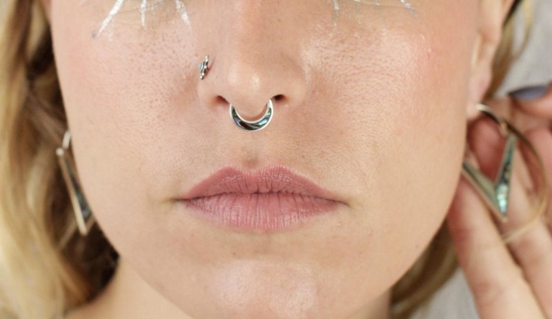 Nose piercing the ring