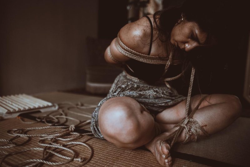 Girl connected by a rope