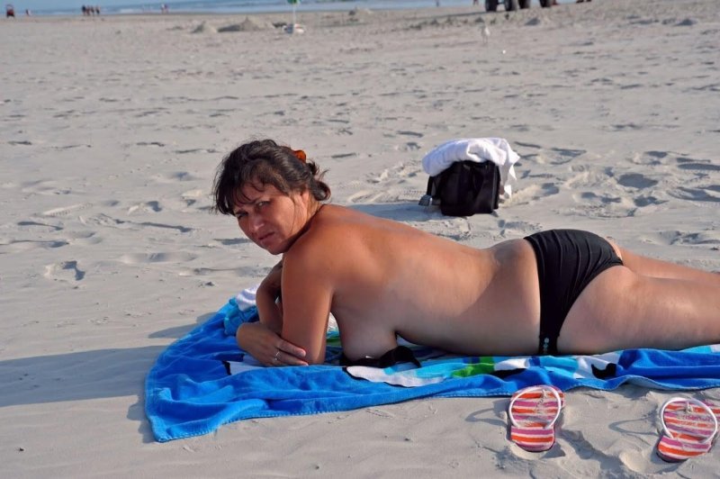 Mature dresses up on the beach