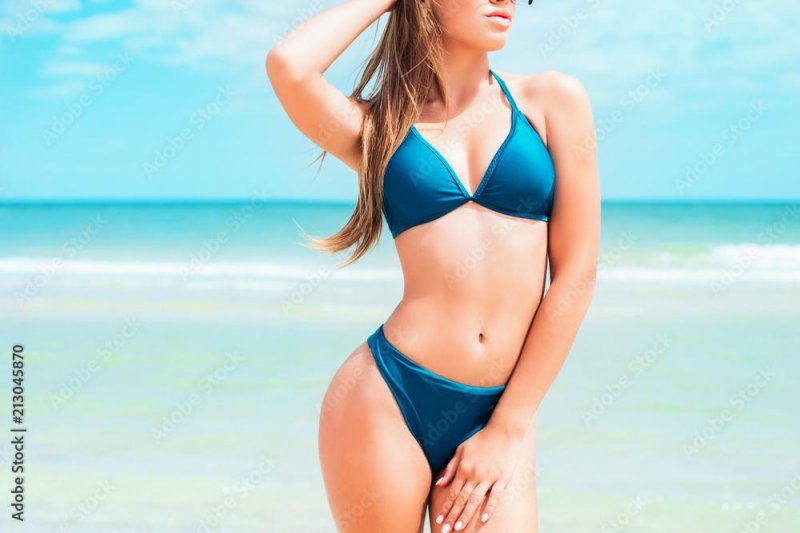 Beautiful girls in a light blue swimsuit