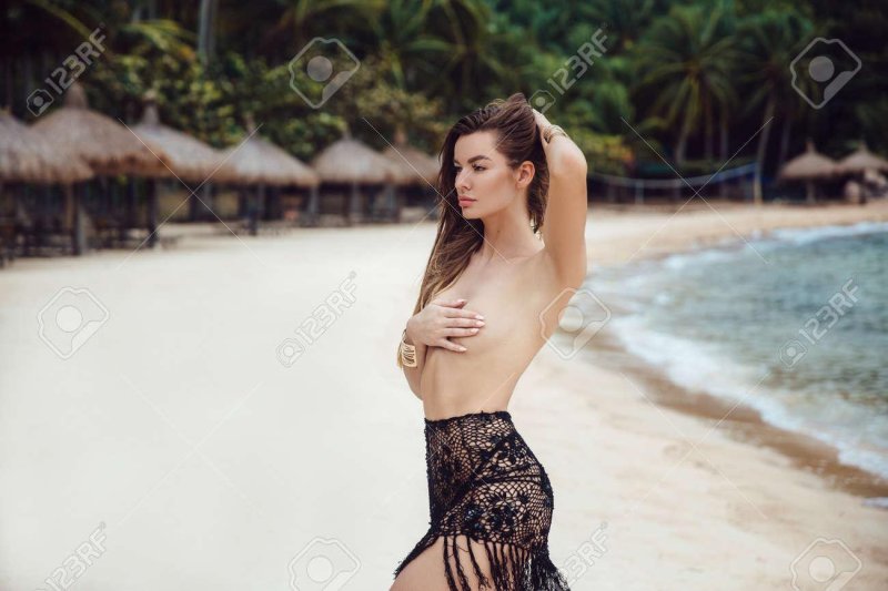 On the beach topless