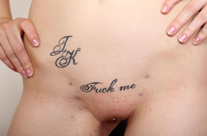 Tattoo inscriptions on female pubis